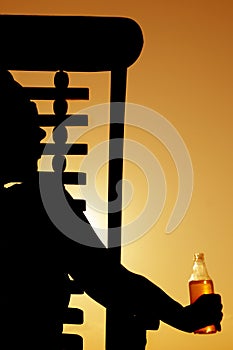Beer and Deckchair sunset silhouette