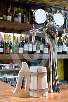 Beer faucet with a mug in a bar