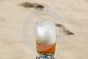 Beer with foam in a glass with a beautiful background