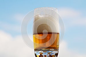 Beer with foam in a glass with a beautiful background