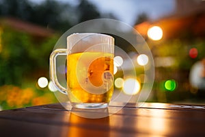 Beer foam outside with blurry lights background