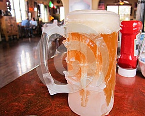 Beer in a frozen mug in a restaurant