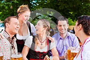 In Beer garden - friends on a table with beer