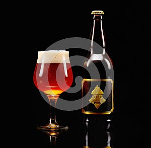 Beer in glass and beer bottle on a dark black background. Mugs with drink like Ipa, Pale Ale, Pilsner, Porter or Stout