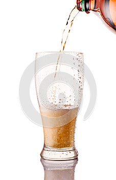 beer glass being poured from bottle isolated on white background