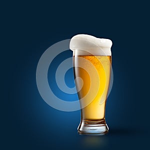 Beer in glass on blue