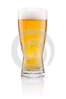 Beer glass with condensation on white background