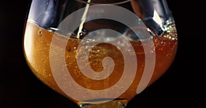 Beer glass with falling water drops.