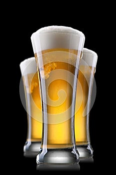 Beer in glass isolated on black