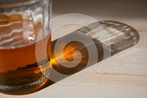 beer glass and reflection on table