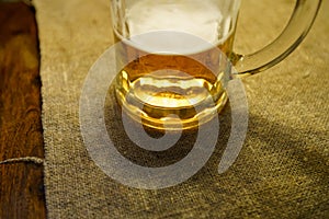 Beer glass at a restaurant table detail