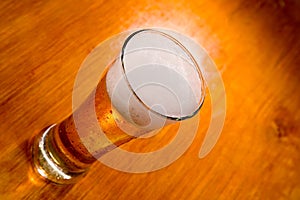 Beer glass on wood background