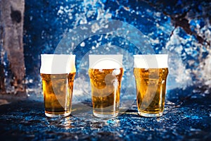 Beer glasses, draught light beers served in pub, restaurant or nightclub