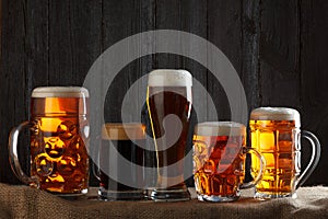 Beer glasses with lager, dark lager, brown ale,