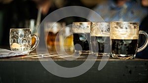 Beer glasses on the table of a bar