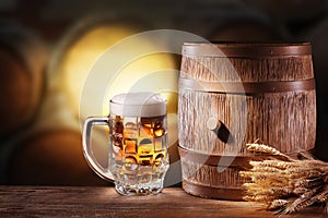 Beer glasses with a wooden barrel.