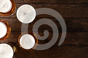 Beer glasses on wooden table