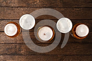 Beer glasses on wooden table with copyspace