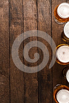 Beer glasses on wooden table with copyspace