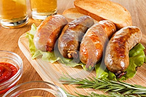 Beer and grilled sausage. Oktoberfest traditional menu.