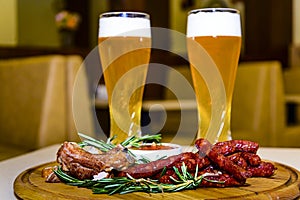 Beer with grilled sausages and pork ribs.