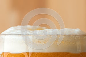 Beer head or collar, frothy foam on top of beverage photo