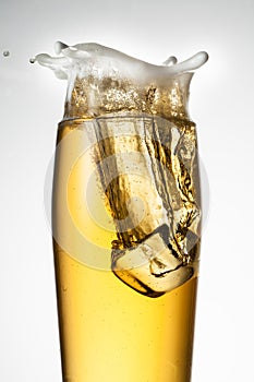 Beer with ice. Splash with drops