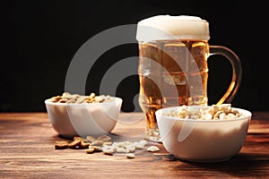 Beer light in a mug and snack