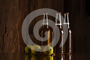 Beer and lime on the background of a wooden wall