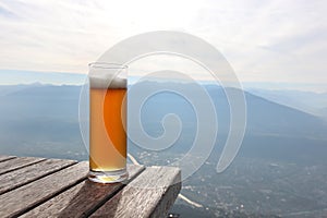 Beer on mountain view. table