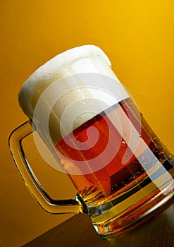 Beer mug close-up with froth photo