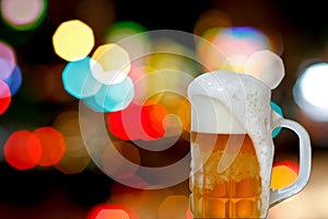 Beer mug with froth and bokeh photo