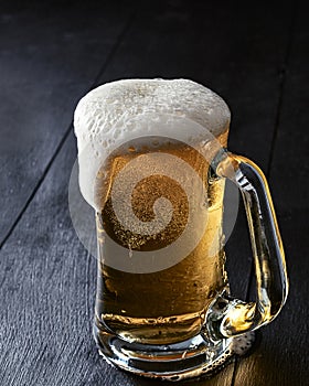 Beer Mug with Frothy Overflowing Beer