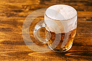 Beer mug full of cold fresh alcohol drink