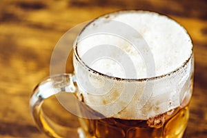 Beer mug full of cold fresh alcohol drink