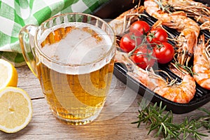 Beer mug and grilled shrimps