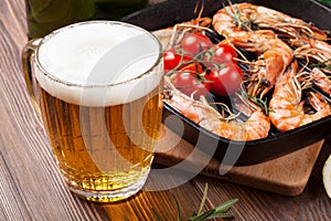 Beer mug and grilled shrimps