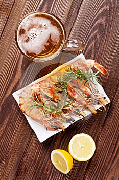 Beer mug and grilled shrimps