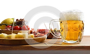 Beer mug and snack on wooden table white isolated background