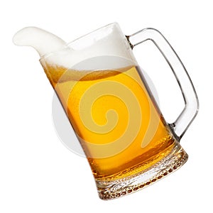 Beer in mug with splashing foam