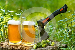 Beer mugs cheers on natural background