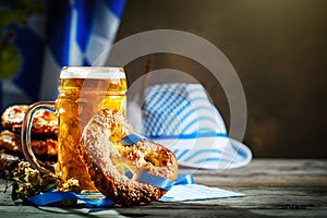 Beer mugs and pretzels on a wooden table. Oktoberfest. Beer festival.