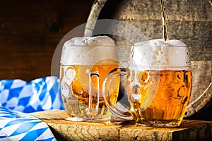 Beer. Oktoberfest.Two cold beers. Draft beer. Draft ale. Golden beer. Golden ale. Two gold beer with froth on top. Draft cold beer