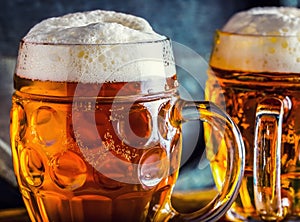 Beer. Oktoberfest.Two cold beers. Draft beer. Draft ale. Golden beer. Golden ale. Two gold beer with froth on top. Draft cold beer