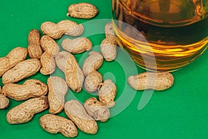 beer peanuts in shells bar alcohol green background