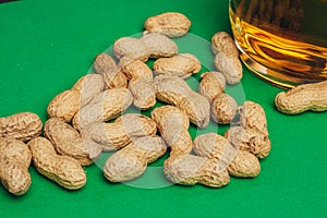 beer peanuts in shells bar alcohol green background