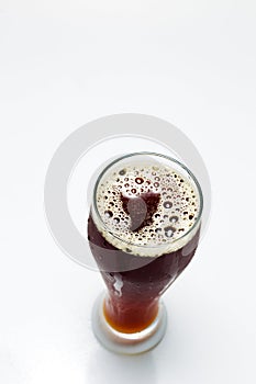 Beer is pouring from a bottle