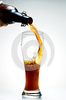 Beer is pouring from a bottle