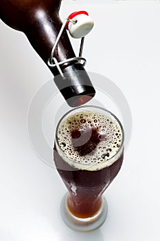 Beer is pouring from a bottle