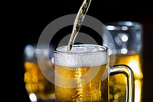 Beer pouring into glass, alcoholic drink